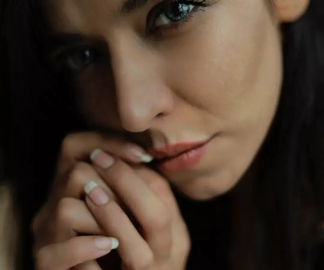This is a moody, intimate portrait where I used natural, soft light to highlight her contemplative expression. The focus is on the quiet intensity in her eyes, creating a portrait that feels both powerful and personal, a style I love for fashion photography.