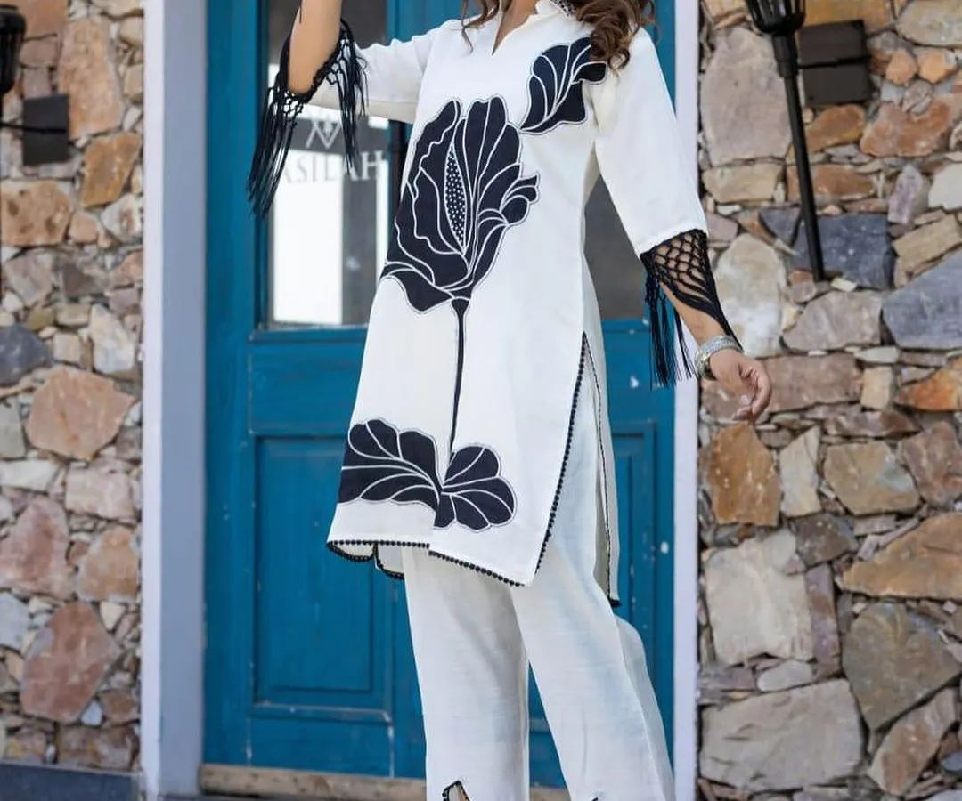 Here is a full view of my black and white floral cord set. This two-piece outfit includes a straight-fit kurta and matching pants, offering a modern and coordinated look that stands out from traditional ethnic wear.