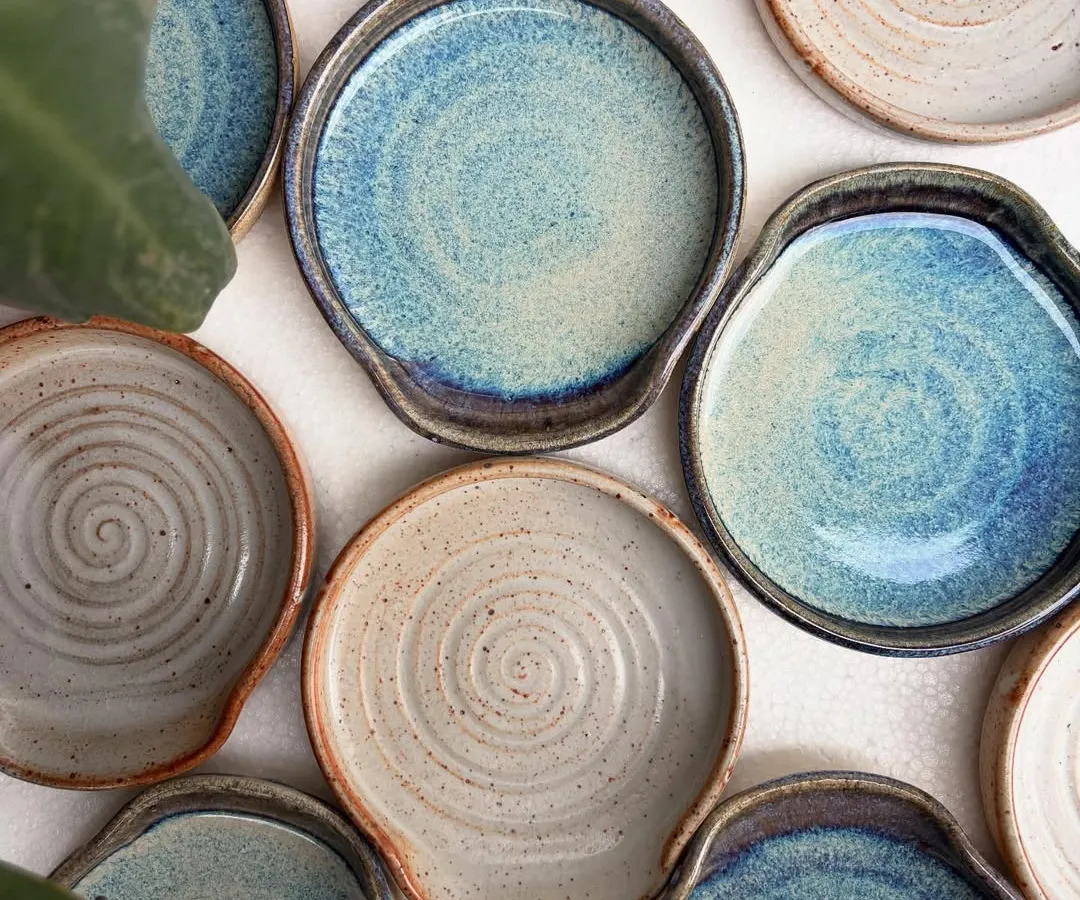 Our spoon rests are always in high demand. This overhead shot shows the beautiful variety of our studio-mixed glazes, including the drippy rutile and earthy shino finishes. Each one is a small piece of functional art for your kitchen.