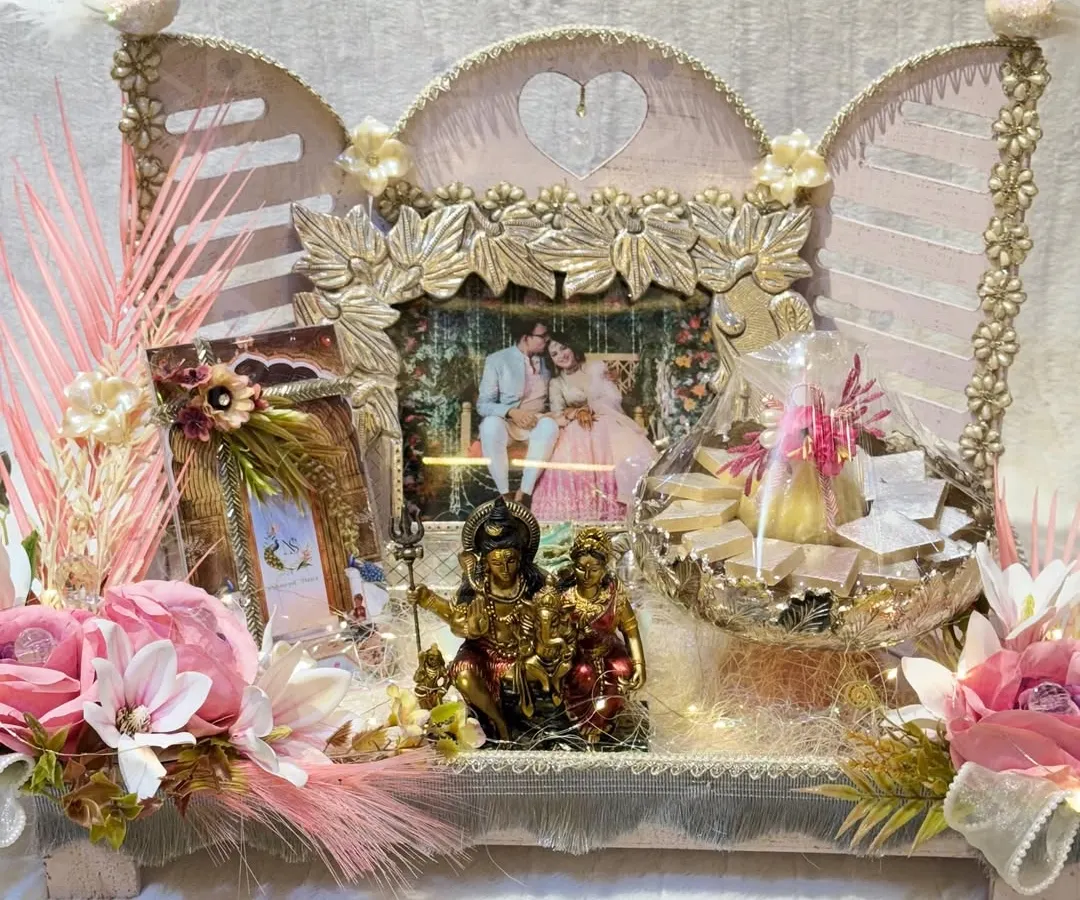 A wedding hamper is more than a gift. It's a gesture of love, beautifully curated with a personalized photo frame, sweets, and blessings. This arrangement was designed for a family to welcome their new member with warmth and elegance.