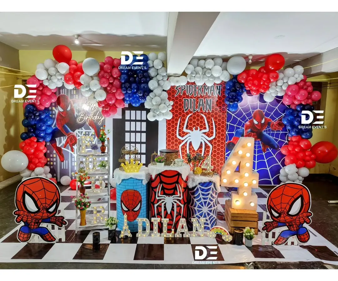 Time to be a hero! I bring the action with this dynamic Spiderman-themed party, complete with a city skyline backdrop, character cutouts, and a classic red, white, and blue balloon arch. It's a setup guaranteed to make your little one's spidey senses tingle.