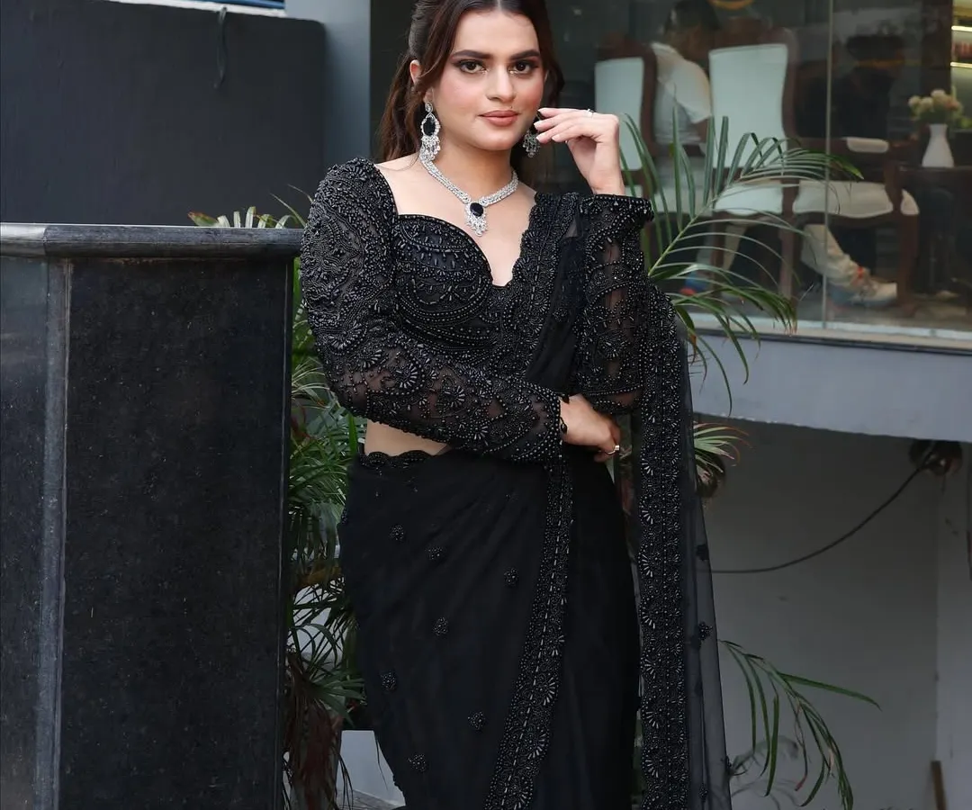 A complete look for your big night out. This stunning party makeup features a smokey eye and flawless base, paired with a sleek high ponytail to highlight the intricate details of the saree.