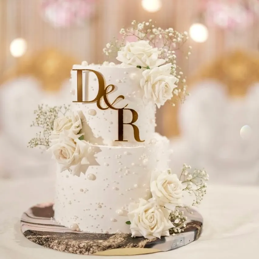 A classic two-tier engagement cake that’s all about timeless elegance. I adorned this beauty with delicate pearls and fresh white roses, creating a romantic and sophisticated centerpiece that tastes as good as it looks.