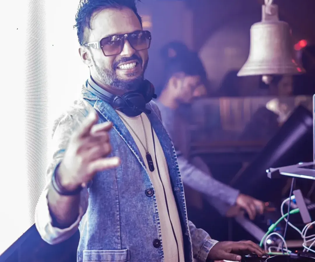 A candid moment behind the console. For me, DJing is about spreading positivity and good vibes, one track at a time. This is me in my element, ready to get the party started.