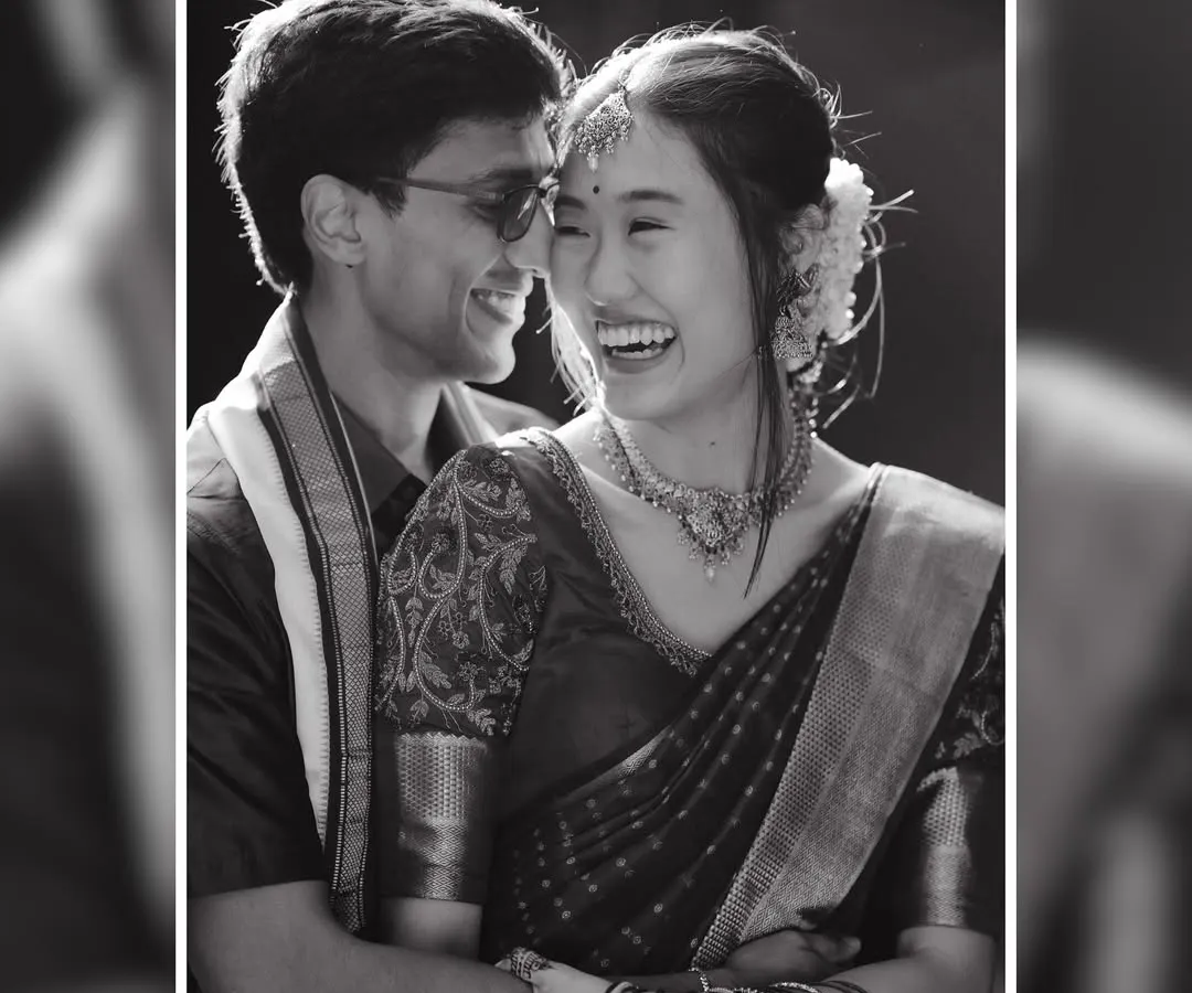 In the midst of grand celebrations, it's the quiet, joyful moments like this that truly define your wedding story. This beautiful black and white portrait captures the pure, unscripted happiness between a couple, a timeless memory I help create.