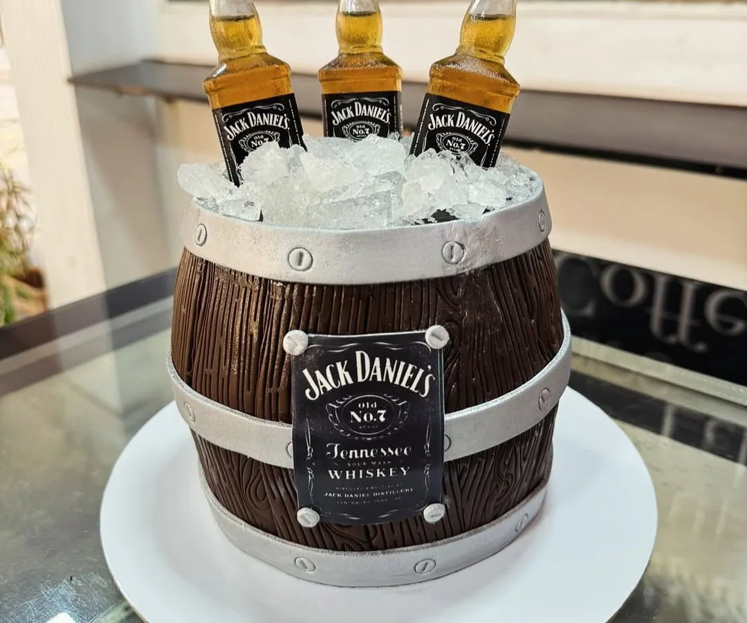 For the whiskey connoisseur, we crafted this realistic Jack Daniel's barrel cake. The wood grain texture and edible ice are all meticulously detailed to create a show-stopping centerpiece for an adult celebration.