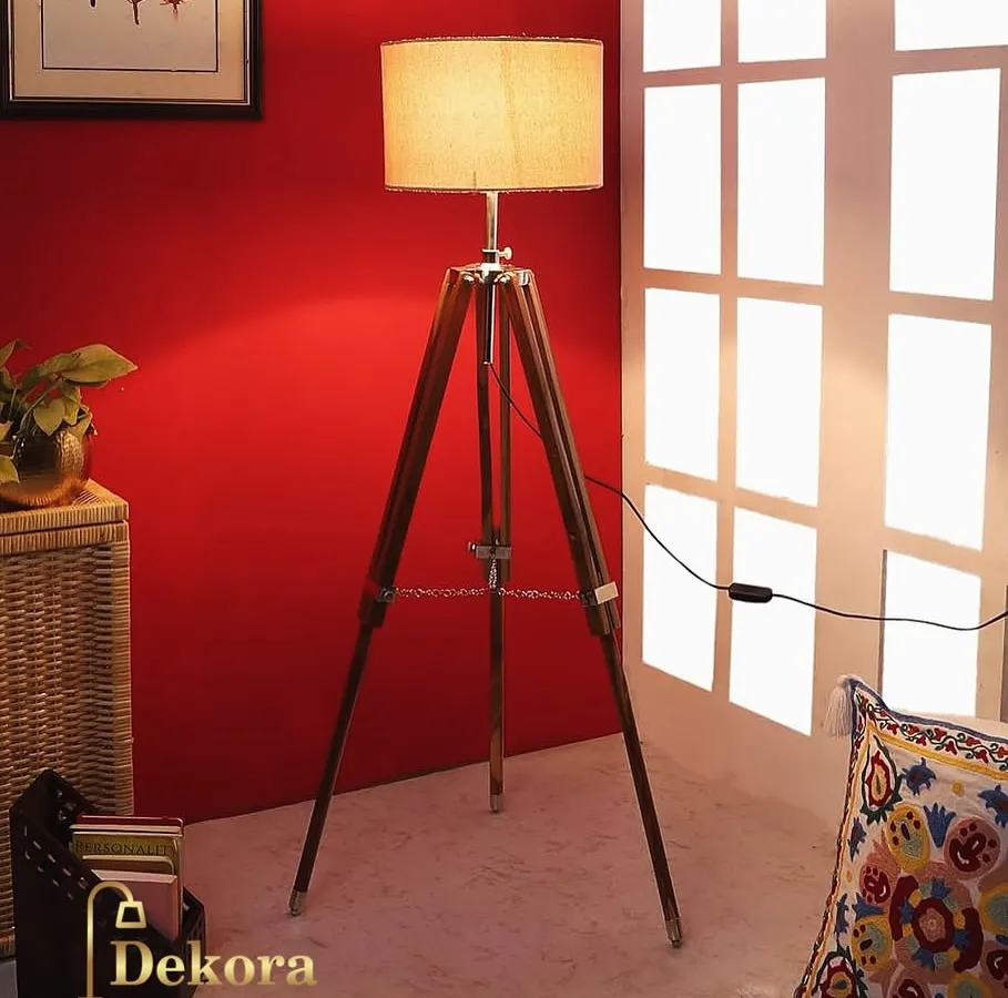 Our classic wooden tripod floor lamp adds a touch of mid-century modern elegance to your home. The sturdy wood construction, complemented by metal accents, provides warm, ambient lighting perfect for a reading nook or office space.