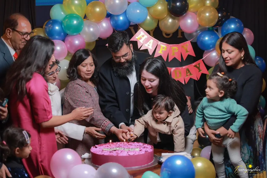 The big cake-cutting moment is always full of love. I focus on capturing the entire family coming together to celebrate, creating a memory that includes grandparents, parents, and the birthday star.
