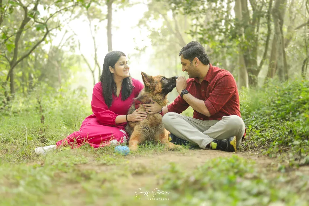 A family is not complete without the pitter-patter of paws. We captured this beautiful moment of connection with a German Shepherd and his loving family in a serene park setting. Our family sessions are designed to be relaxed and fun, allowing these natural interactions to shine.