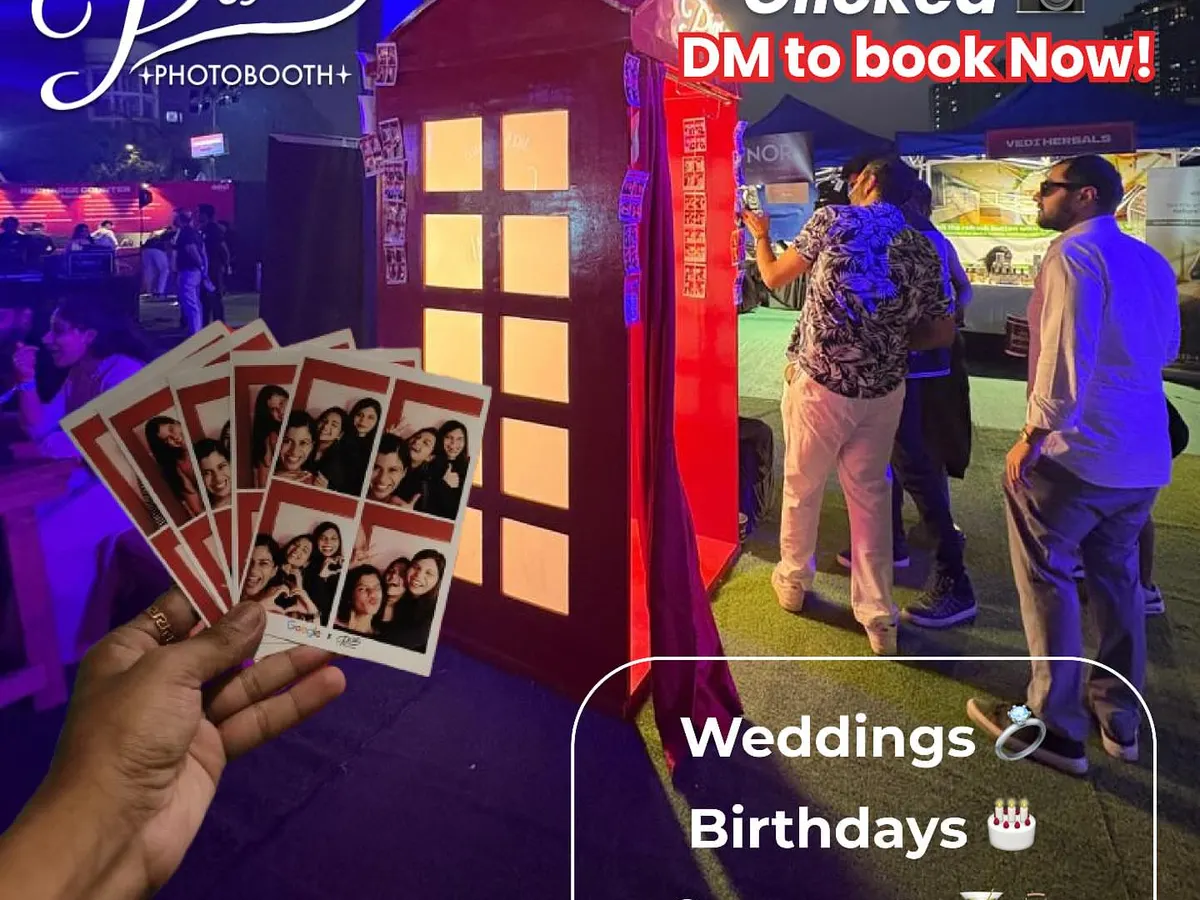 We're ready for any celebration. This shot from an outdoor festival shows our booth in action, with guests lining up for their turn. I love seeing people's faces light up when they get their instant photo strips, which we can customize for weddings, birthdays, and corporate events.