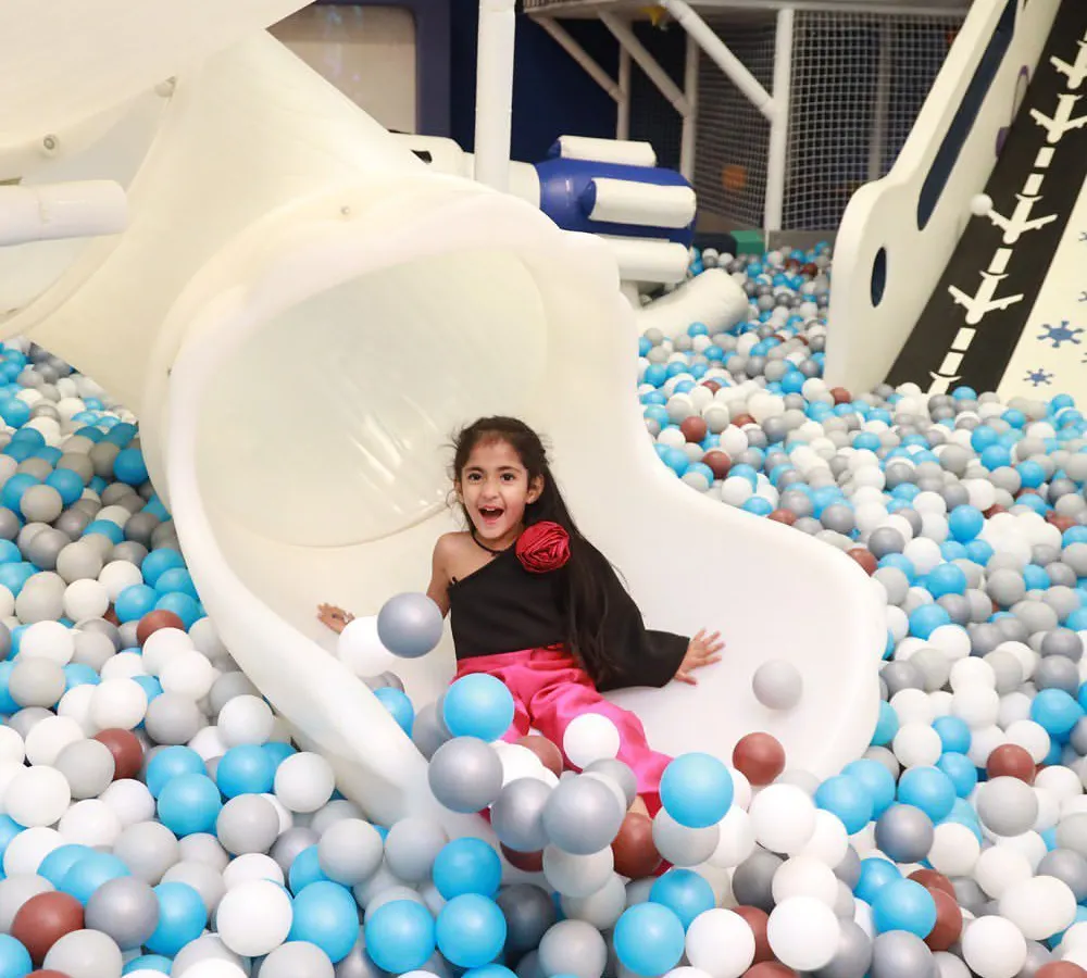 The pure joy of sliding into a sea of colorful balls! Our giant ball pit and slide is a favorite, providing endless laughter and picture perfect moments.