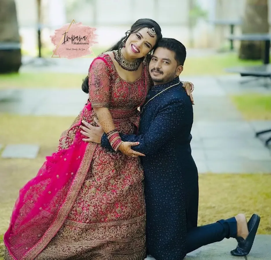 A joyful moment between the bride and groom at their reception. I created a glamorous yet elegant look for the bride's lehenga, focusing on makeup that shines in photos and lasts through a night of celebration.