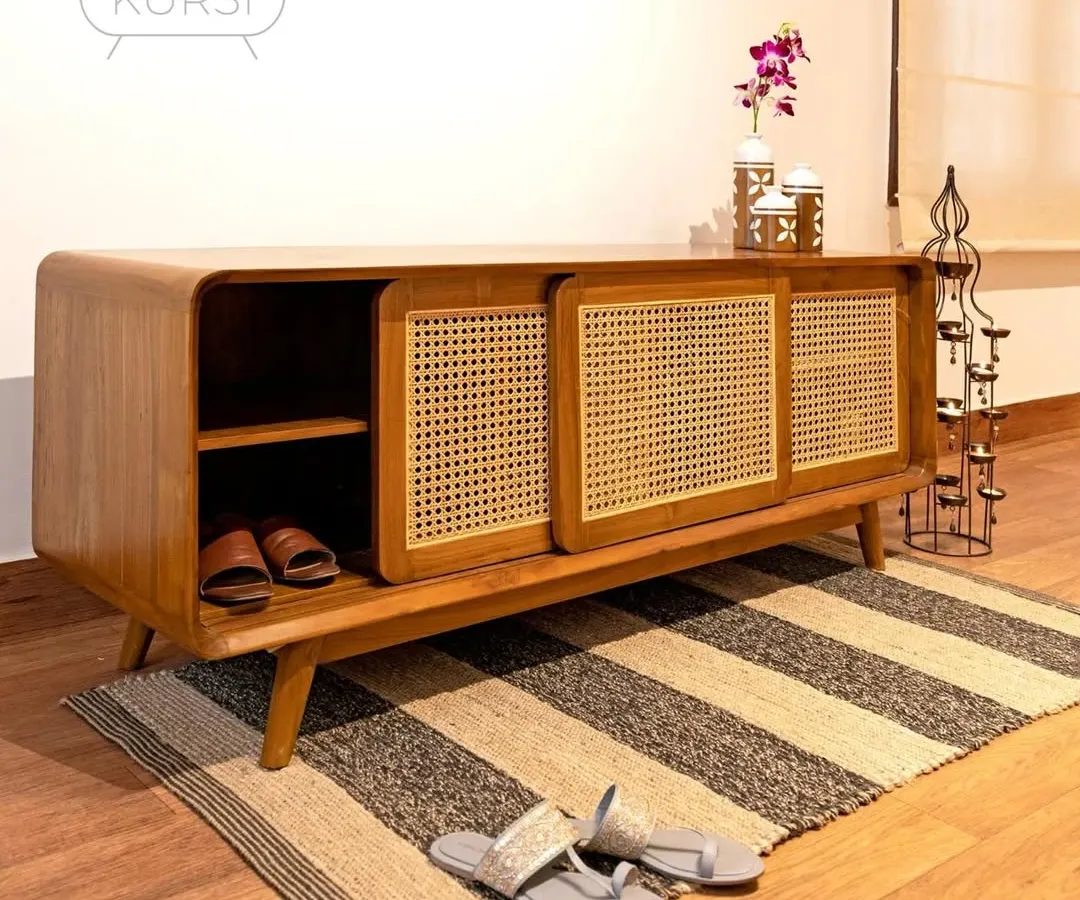 Meet Penthes, my solution for an elegant and organized entryway. This shoe rack, crafted from rich teak with sliding rattan doors, combines practical storage with a refined aesthetic that welcomes you home.