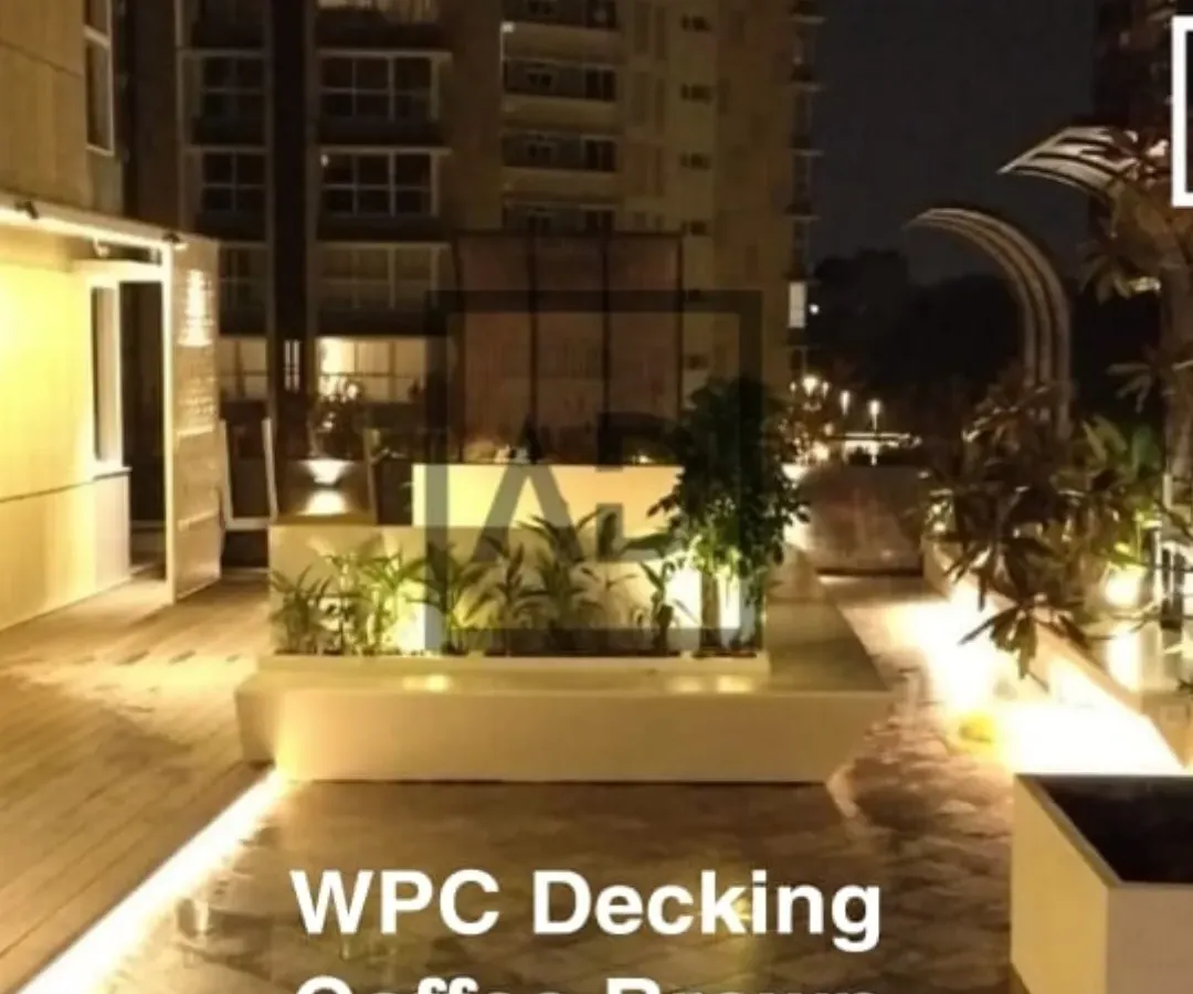 Here is a WPC (Wood Plastic Composite) decking project for a terrace, shown at night. The coffee-brown decking is completely waterproof and handles sun and rain without fading, making it ideal for Bangalore weather. The integrated lighting transforms the area into a stylish, usable space after dark.