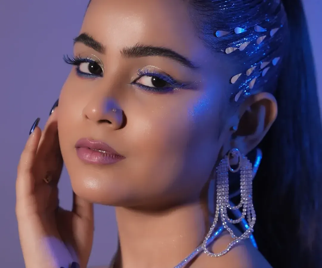 I push my students to go beyond traditional makeup and explore high-fashion artistry. This look showcases advanced techniques in color blending, graphic liner work, and the use of embellishments to create editorial-quality results.