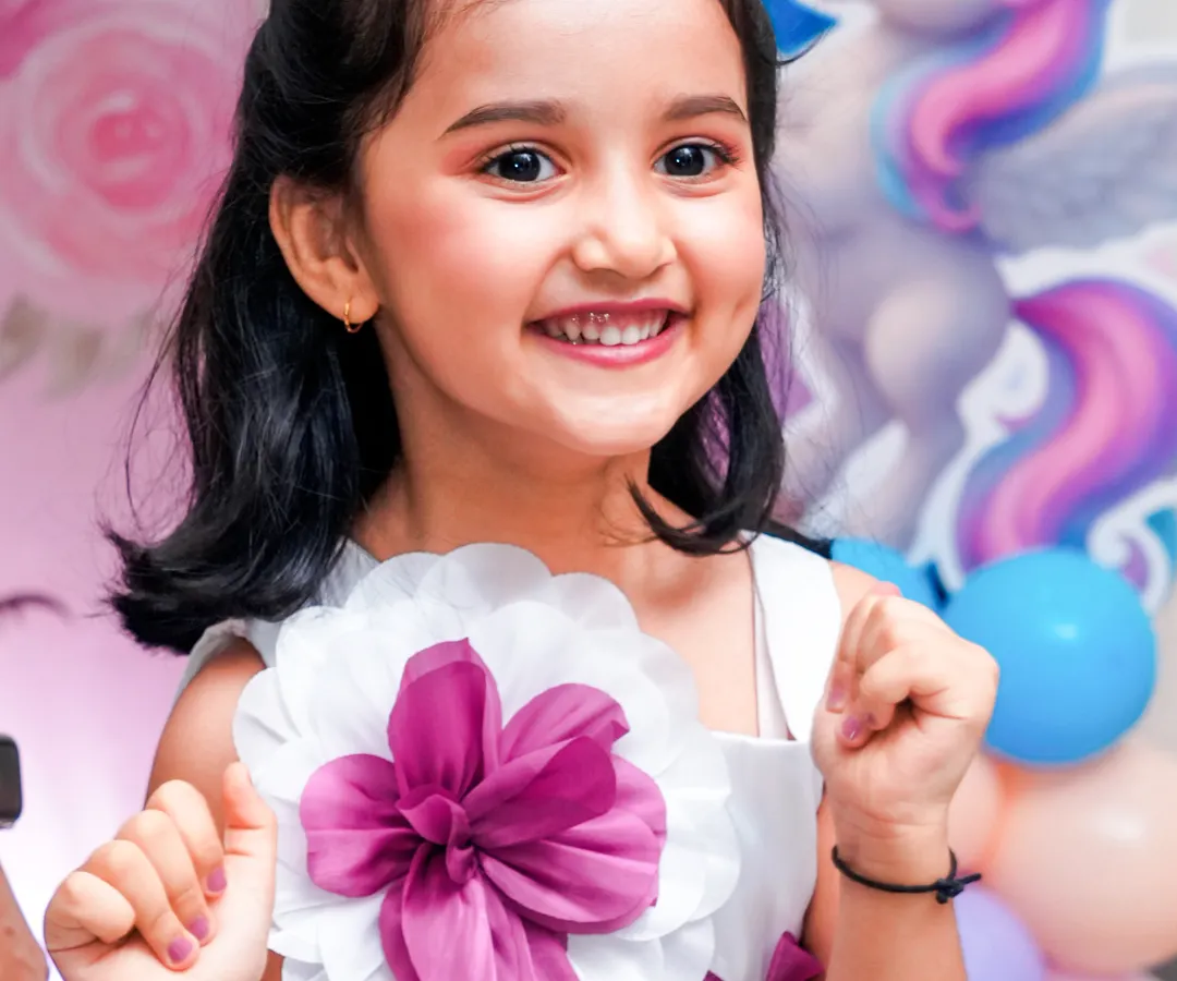 The birthday star's radiant smile says it all. Our goal is to capture that genuine happiness in beautiful, relaxed portraits you will cherish forever.
