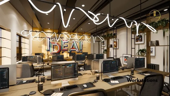 We believe a workspace should inspire creativity. For this IT office in Noida, we designed an open-plan workstation area with custom "IDEA" lighting to create a vibrant, high-energy environment that fosters collaboration and innovation.