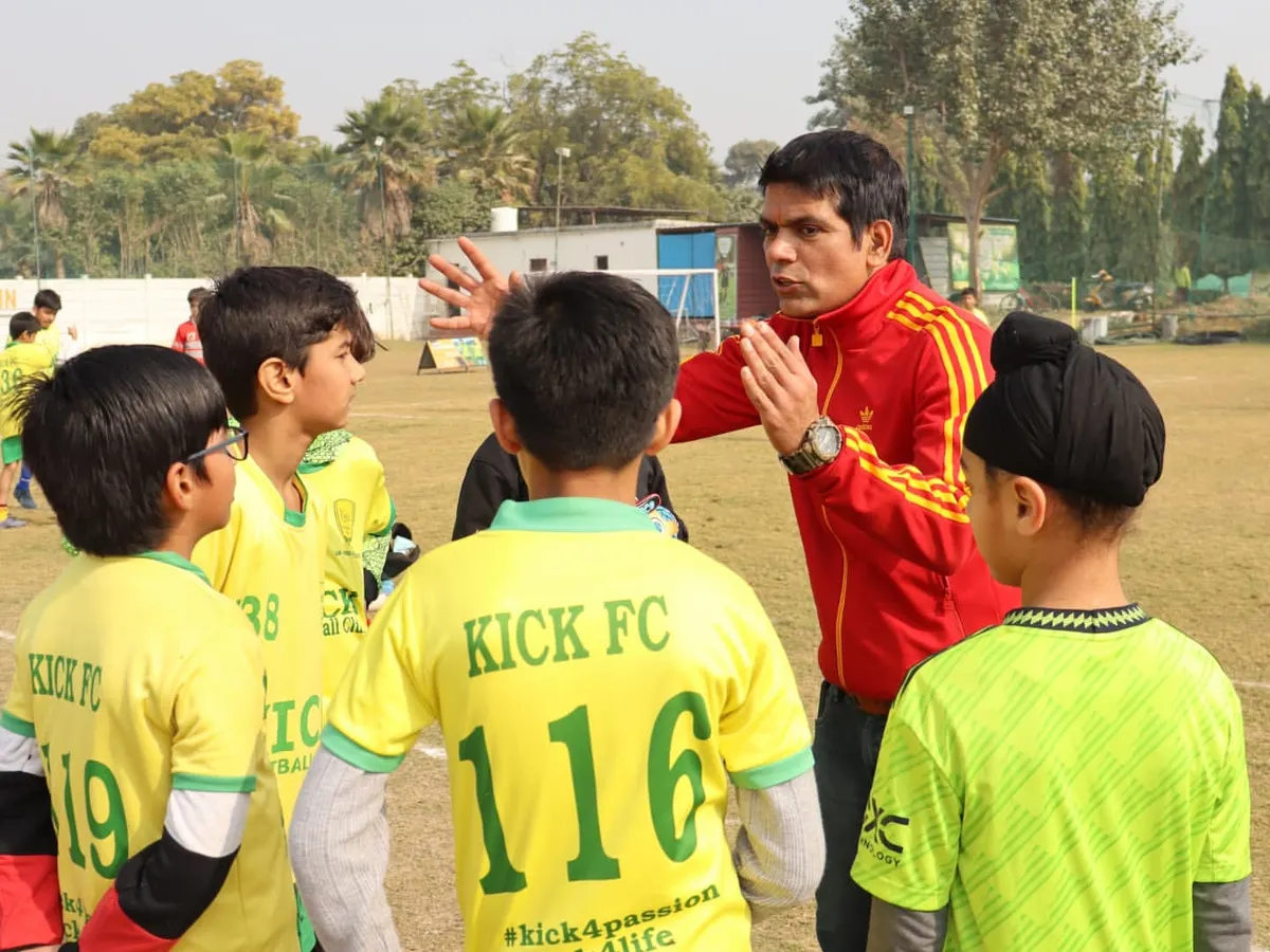 A quick huddle before the game is where strategy meets motivation. Here, one of our coaches discusses tactics with the team, ensuring every player understands their role. We believe clear communication and mentorship are key to building a confident team.