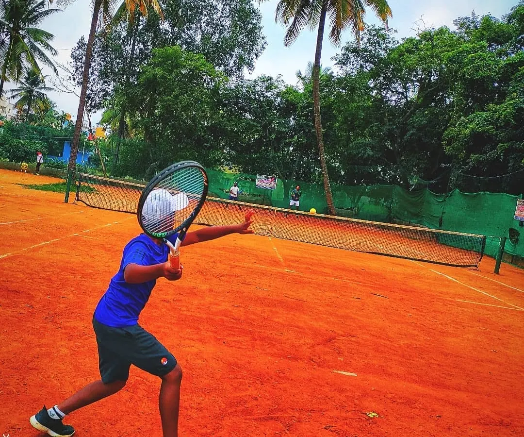 We start them young. Here’s one of our junior players executing a powerful forehand during a lesson, showing great form and focus. Our junior tennis program is designed to build a solid foundation from the very beginning.