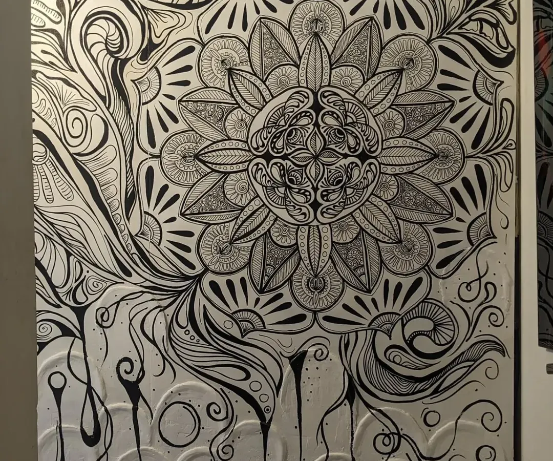 Here is the complete view of a mandala mural I created, combining a textured white base with intricate black doodle work. This piece was designed to transform a simple wall into a focal point of calm and detailed beauty, with every line and pattern painted by hand.
