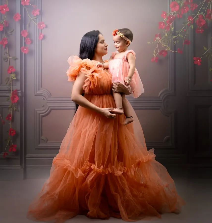 Capturing the timeless bond between a mother and her child. This portrait showcases one of my fine-art sessions, using soft lighting and elegant gowns to create a dreamy, painterly effect that you will cherish forever.