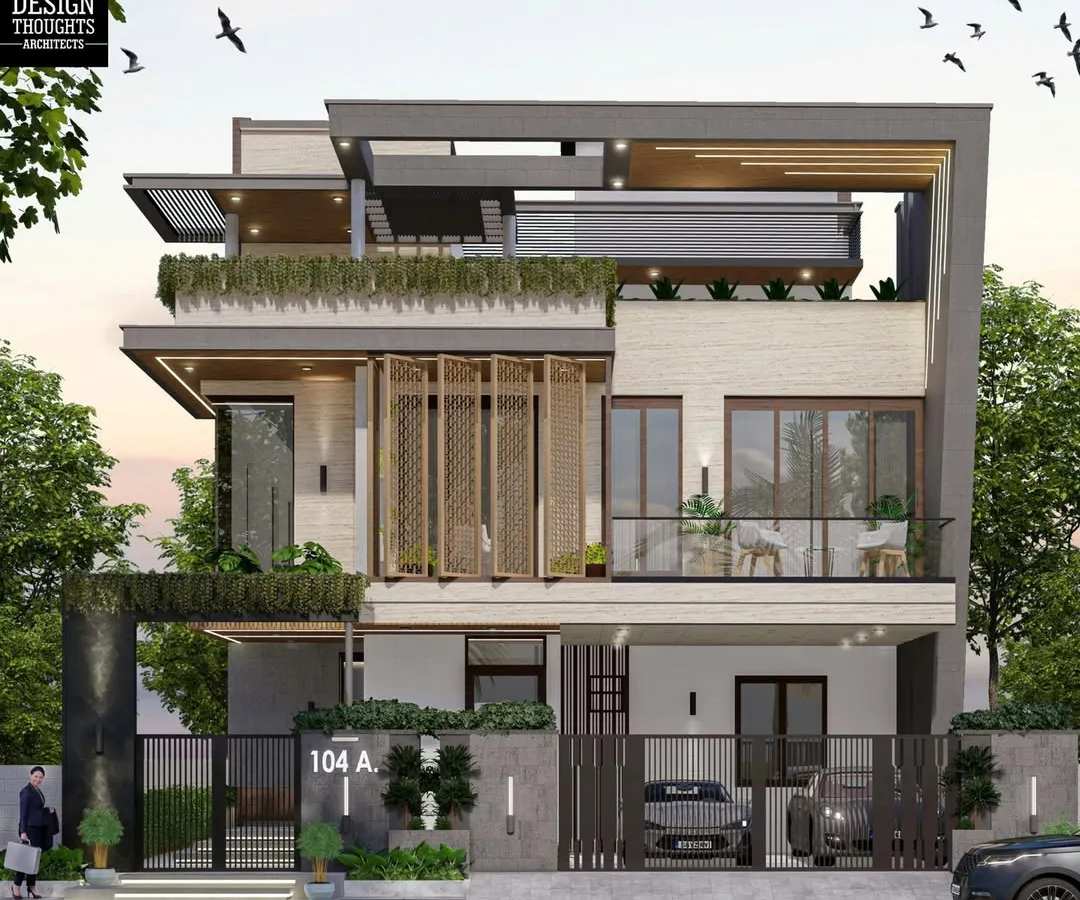 We designed this modern 50x80 duplex in Bengaluru to be a statement of contemporary living. The elevation features a dynamic play of angular facades, MS jaali screens, and integrated green spaces, creating a home that is both visually striking and perfectly suited for a modern family's lifestyle.