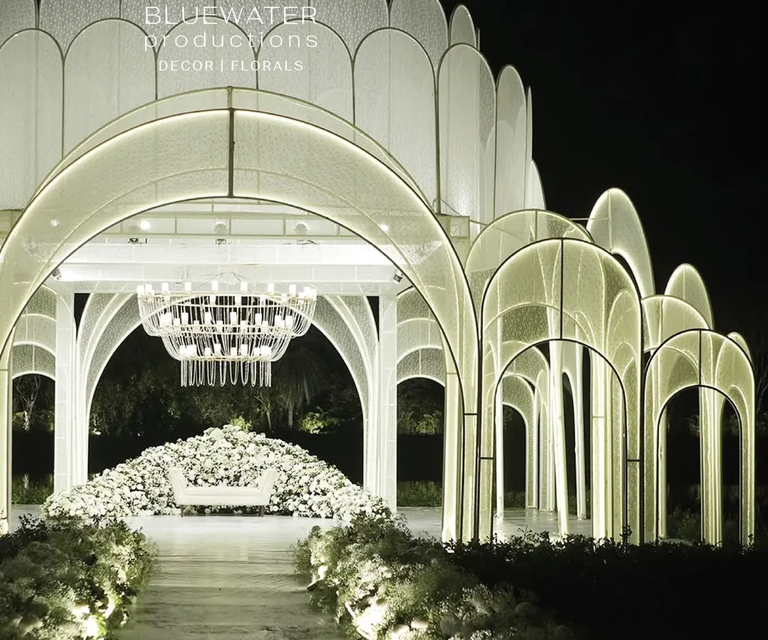 For this lakeside reception, we designed and built a floating palace. The entire structure, clad in delicate lace and illuminated from within, created a breathtaking, ethereal glow over the water.