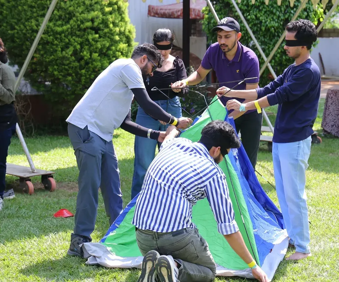 Forget boring trust falls. We design unique team bonding activities like this blindfolded tent pitching challenge. It is a fun, hands-on problem solving game that requires communication, collaboration, and a lot of laughter to succeed, revealing leadership skills you might not see in the office.