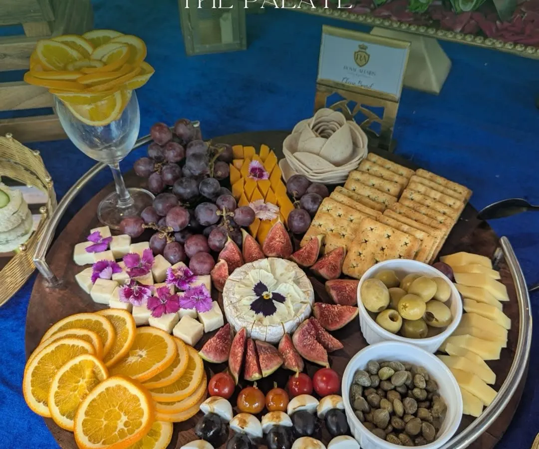 I believe food should be a feast for the eyes and the palate. This vibrant grazing platter features a curated selection of cheeses, figs, grapes, and assorted crackers, all artfully arranged to be the stunning centerpiece of your gathering.