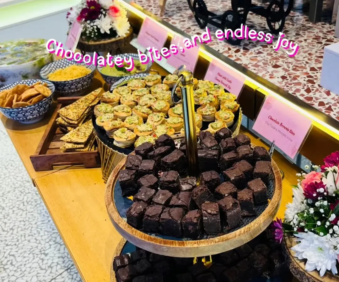 A glimpse of our elegant appetizer spread for a corporate event with Tira Beauty. We served delicious chocolatey brownie bites and savory mini tarts, proving that professional events can be full of fun flavors. Our presentation is designed to impress your guests from the first look.