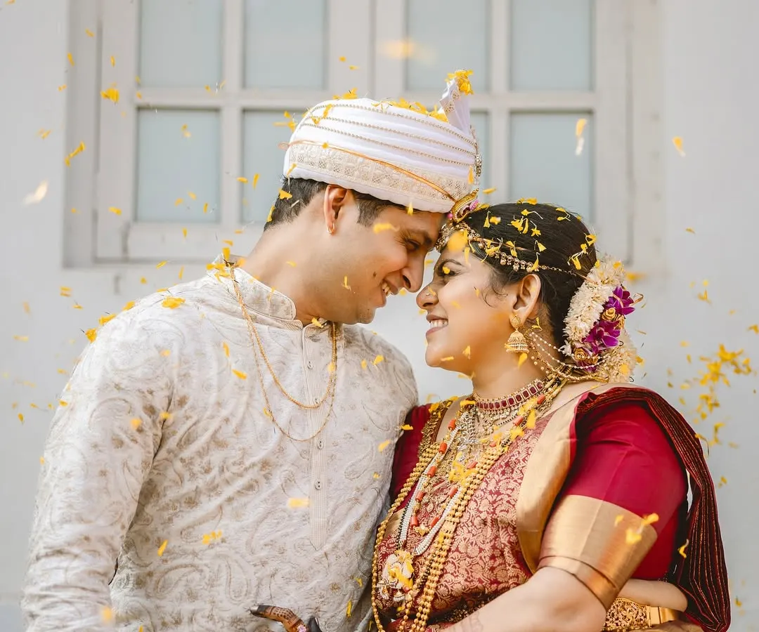 The pure joy of a wedding ceremony, with flower petals showering the happy couple. I focus on capturing these peak candid moments that you'll cherish forever.