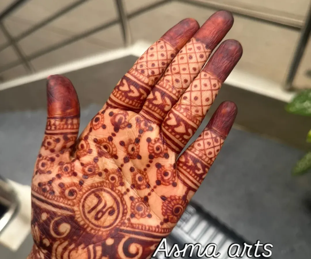 Here is the beautiful, deep maroon stain that develops from my 100% organic henna. There are no chemicals and no filters, just pure, natural color. I also love adding personal touches like the couple's initials in a custom mandala design.