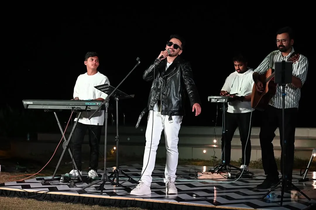 Here is a look at my full band setup during an outdoor concert. We bring a high-energy, rockstar vibe perfect for making a big impact at corporate offsites or private celebrations. This setup includes professional sound and lighting to create a complete concert experience.