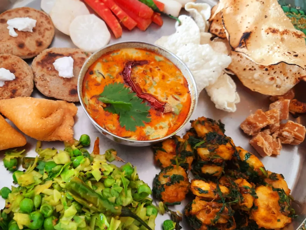 A classic Gujarati winter thali that feels like home. This plate features bajra roti with a dollop of my homemade vegan butter, spicy dahi tikhari made from soy-cashew curd, and seasonal vegetables. I help restaurants create regional menus that are authentic, comforting, and entirely plant-based.