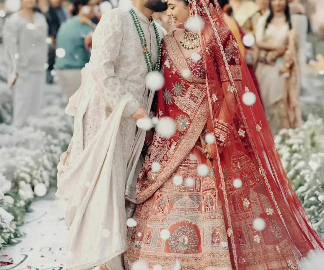 A quiet moment of affection amidst the ceremony. For me, capturing these unscripted gestures is just as important as the grand rituals. This is the timeless love story of Kunal and Parul.