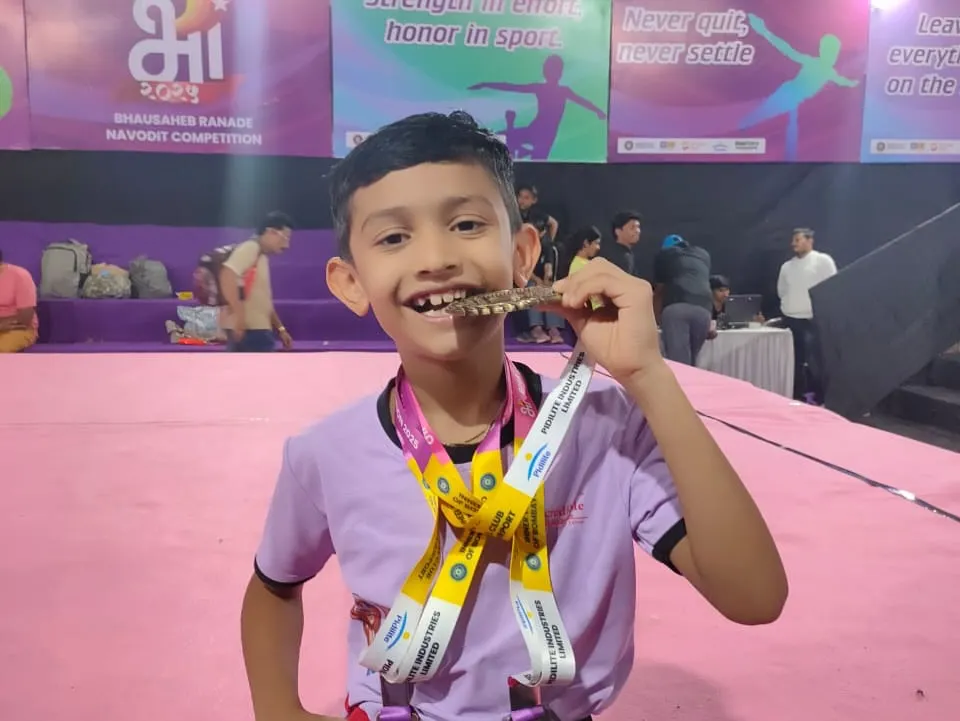 This smile says it all. The joy of achievement after months of discipline and practice is priceless. We don't just train gymnasts; we build champions who wear their hard-earned medals with pride.