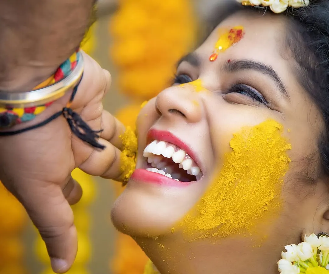 The pure, uninhibited laughter of a Haldi ceremony. We believe the best moments are unposed. Our goal is to make you feel so comfortable that you forget we are there, allowing us to capture genuine expressions of joy like this one.