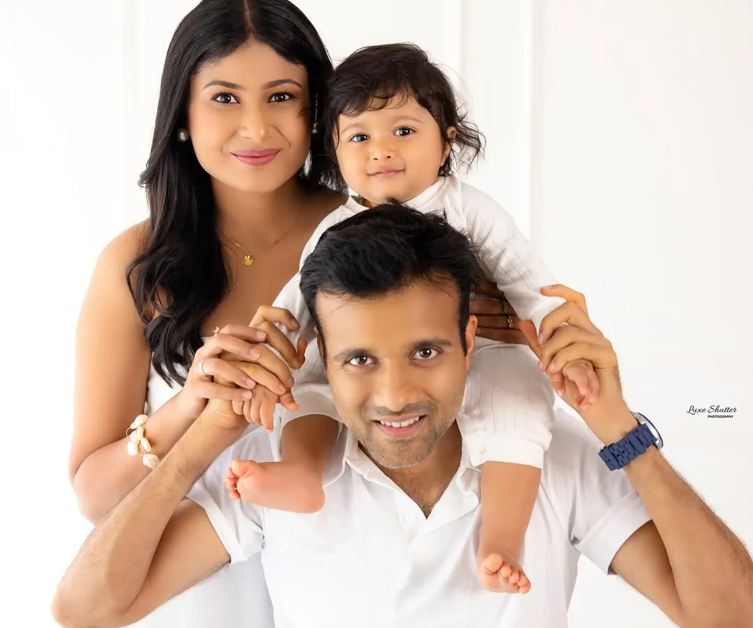 The classic family portrait, reimagined. We guide you into comfortable, natural poses that let your family's love shine through, creating timeless images against a clean, minimalist backdrop. This is a perfect example of our natural light family sessions.