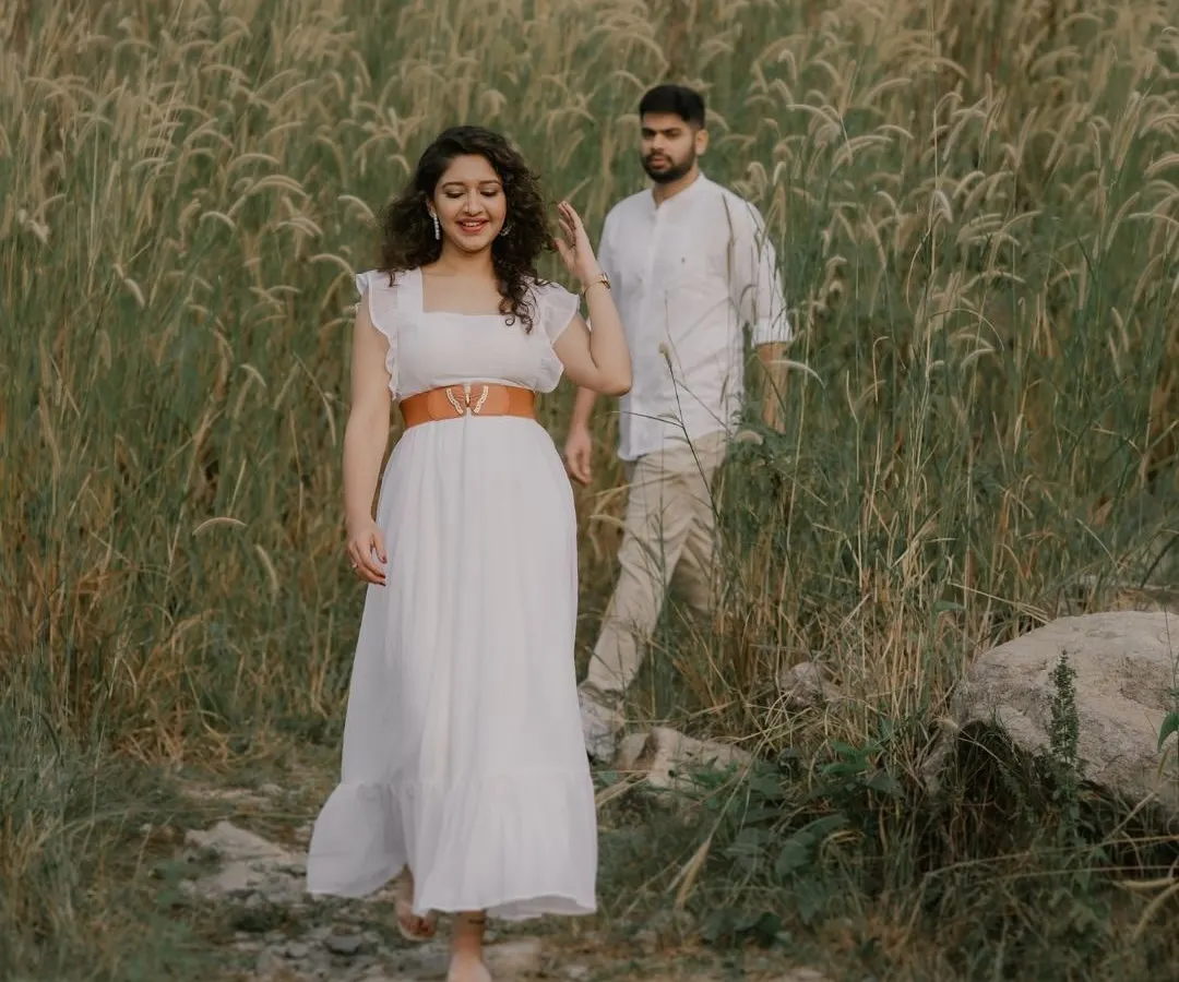 The pure, uninhibited joy of running through a field together. My goal is to create a space where you can be yourselves, resulting in candid engagement photos that are full of life and laughter.