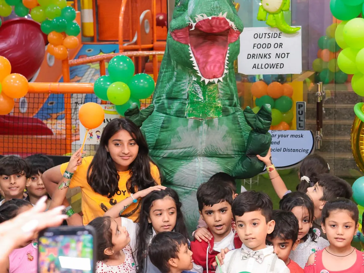 This is what pure party excitement looks like. We hosted a dinosaur-themed birthday bash, complete with a T-Rex mascot that had all the kids roaring with joy. I can bring any theme to life for your child's special day.