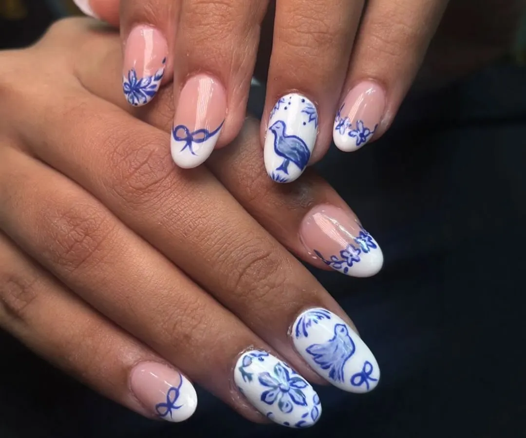 Art is where I have the most fun. I love hand-painting tiny details, like this blue and white design inspired by classic pottery. Each element, from the birds to the delicate bows, is carefully painted to create a unique, wearable piece of art.