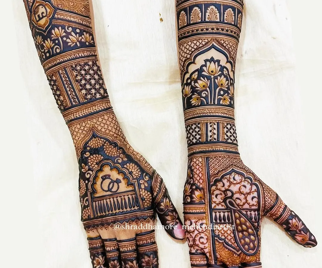 A complete bridal mehendi set that balances intricate details with bold, clear patterns. I combined traditional jharokha designs, lotus motifs, and classic engagement rings to tell a story across both arms, ensuring a symmetrical and stunning look.