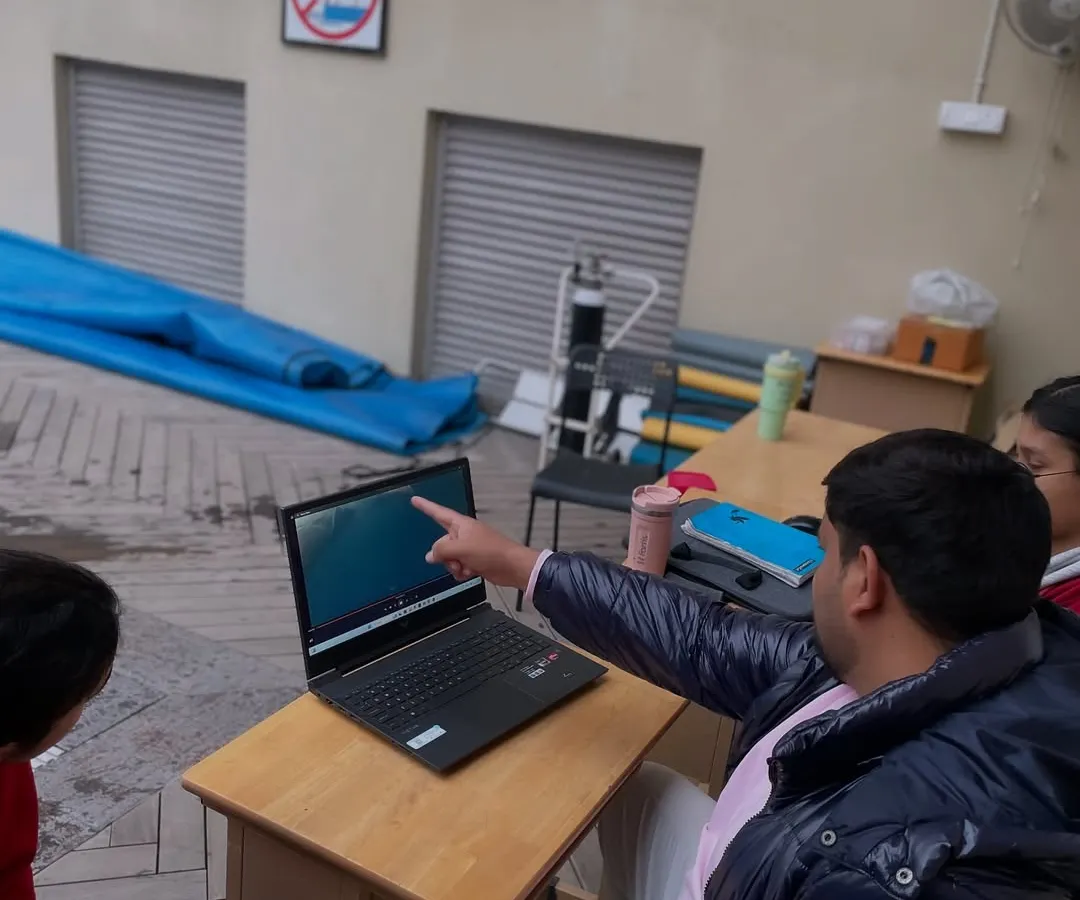 Our coaching is built on a scientific foundation. Here, I am using video analysis to give a swimmer precise, actionable feedback on their stroke biomechanics. We believe in mastering technique before chasing speed, ensuring every lap has a purpose and contributes to long term improvement.
