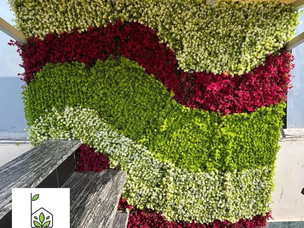 Your walls don't have to be boring. This is a custom artificial green wall I designed for a bar counter in Kailash Colony, using UV-coated materials to create a unique, wavy pattern that grabs attention.