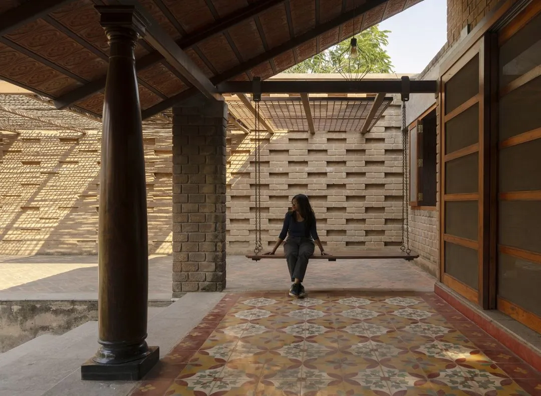 This is from our Kaattu Veedu Guesthouse project, where we embraced earthy and sustainable design. The shaded verandah features handmade Athangudi tiles and restored wooden columns from old homes in Karaikudi, connecting the space to both nature and history.