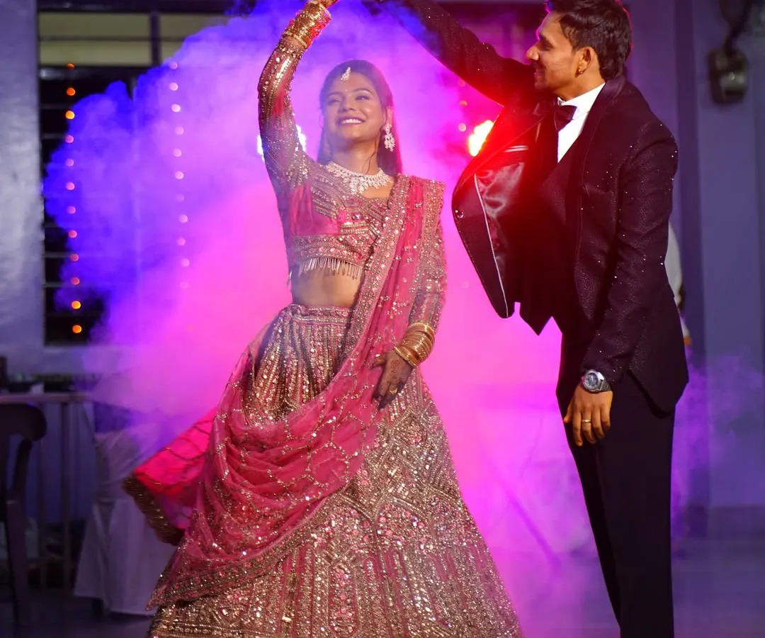 A magical first dance at a wedding reception. I use creative lighting and smoke effects to create a cinematic feel, turning your special moments into unforgettable, movie-like memories. This is a perfect example of my candid event photography style.