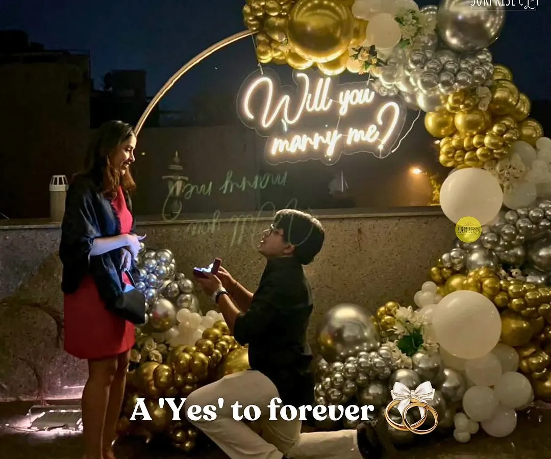 There’s nothing more special than being part of a 'yes' moment. For this rooftop proposal, we created a romantic circular arch with gold and silver chrome balloons and a custom "Will you marry me?" neon sign to make sure the memory would last a lifetime.