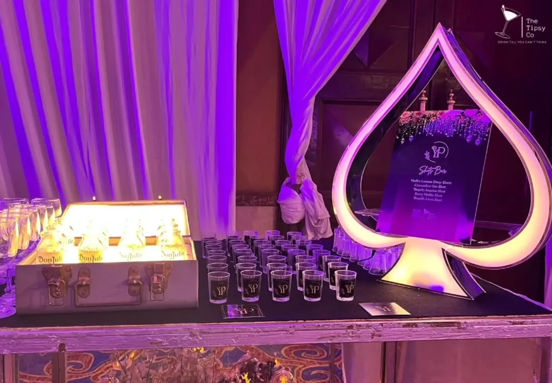 For a casino-themed night, we designed this custom Ace of Spades shot bar. It's an example of how we build unique, immersive experiences around your event's theme, complete with glowing displays and signature shots.