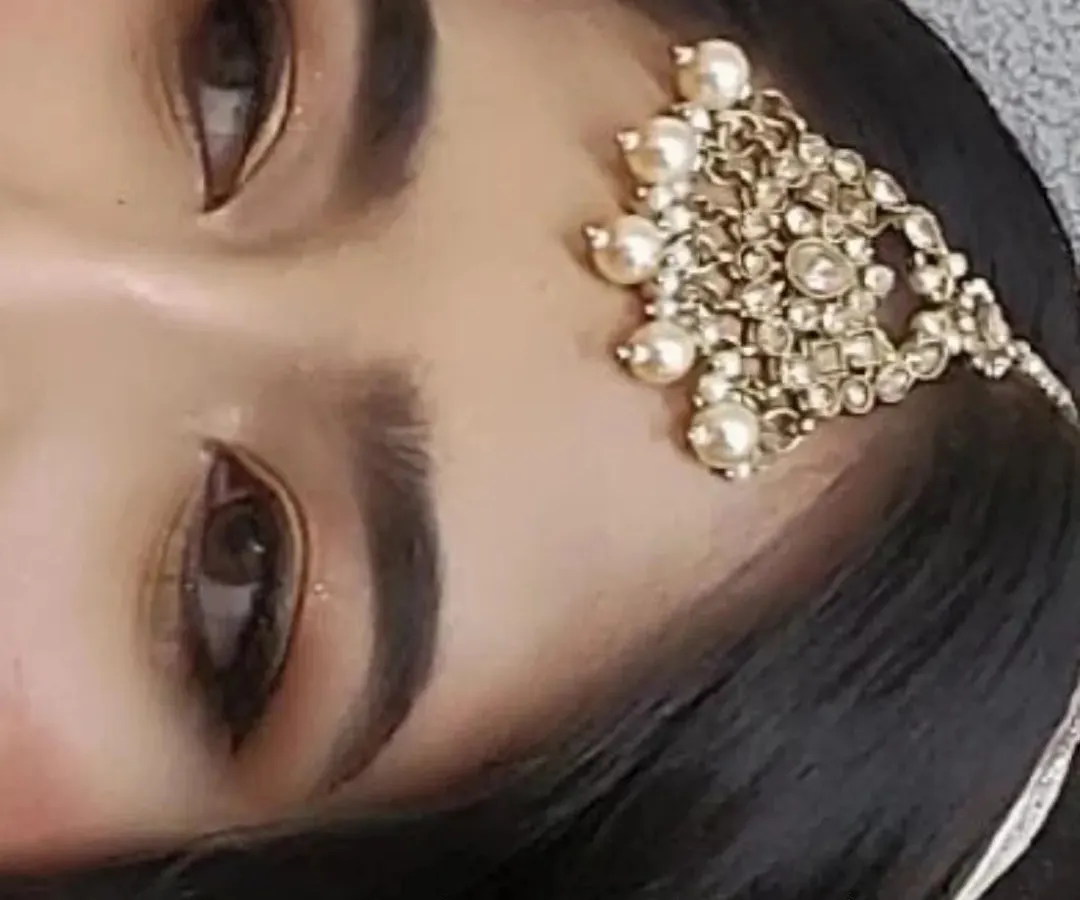 A close-up of a classic engagement makeup look. I focused on creating a soft, smokey eye with well-defined brows that enhance the client's natural features without feeling too heavy. This is a great example of my subtle glam style.