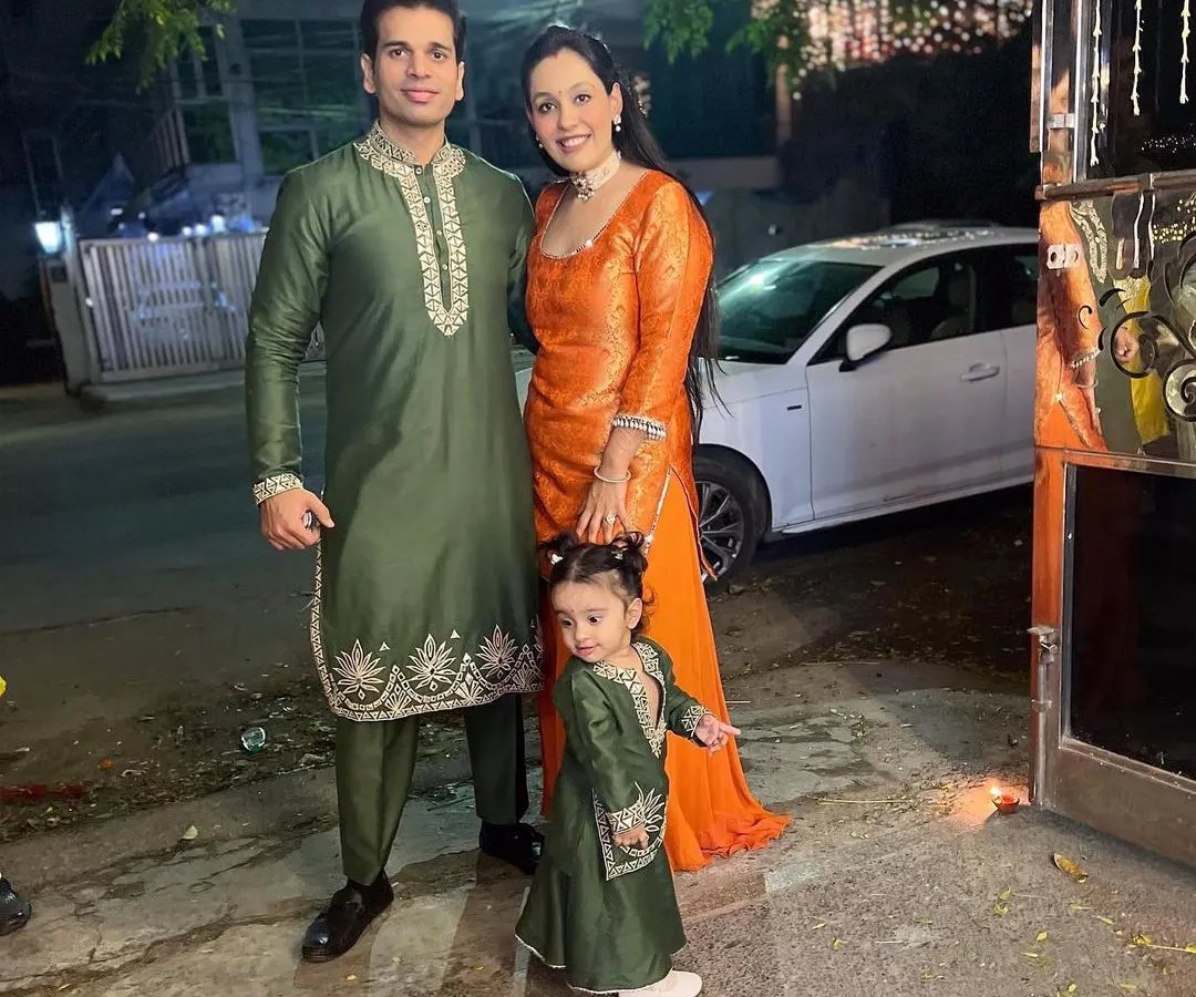 We love dressing the entire family for festive occasions. Here is a beautiful family coordinated for Diwali in rich green and orange ethnic wear. The custom kurta sets feature intricate leather embroidery, designed to create a cohesive and elegant look for your family portraits.